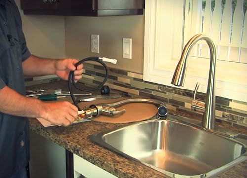 plumber replace kitchen sink tap